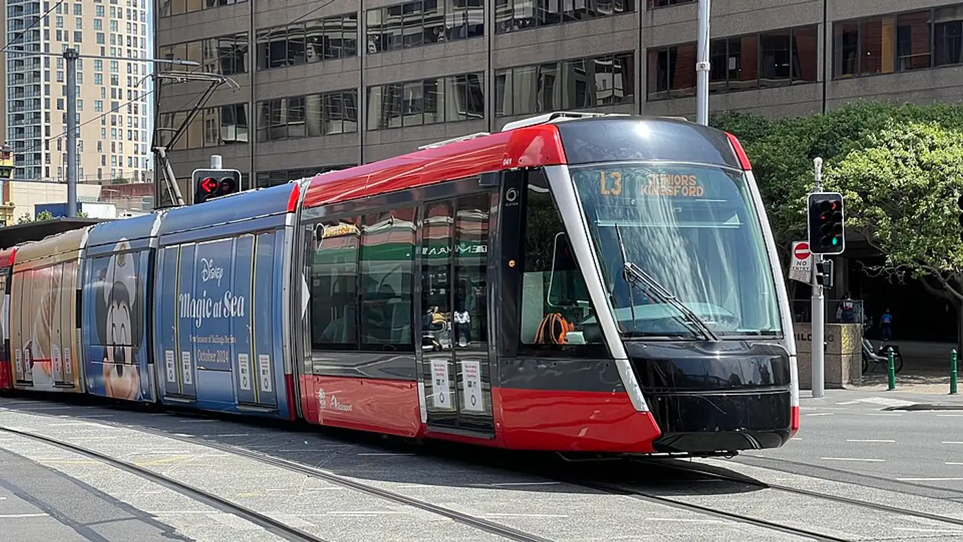 Light rail vehicle on Parramatta Road near the Sydney CBD at sunset