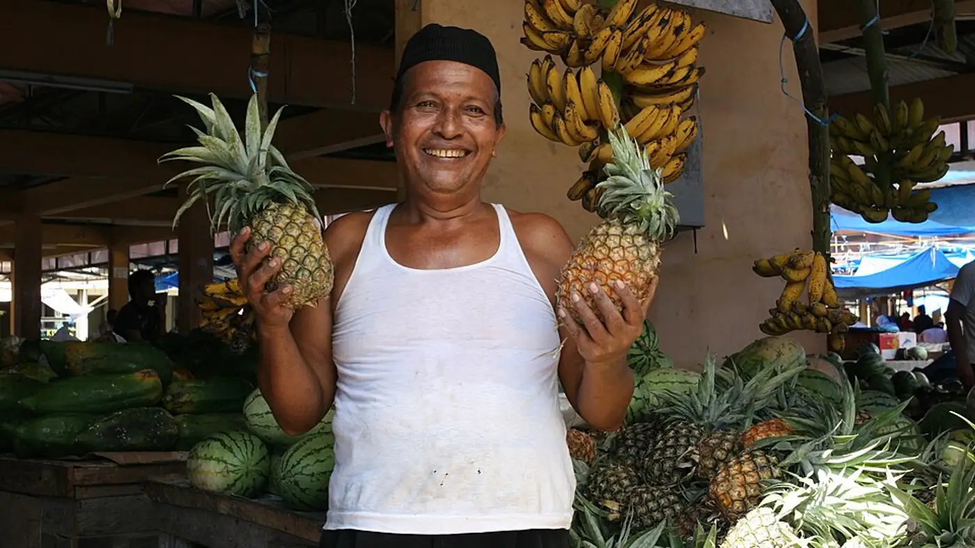 Shop owner at the counter of a small Sydney retail business