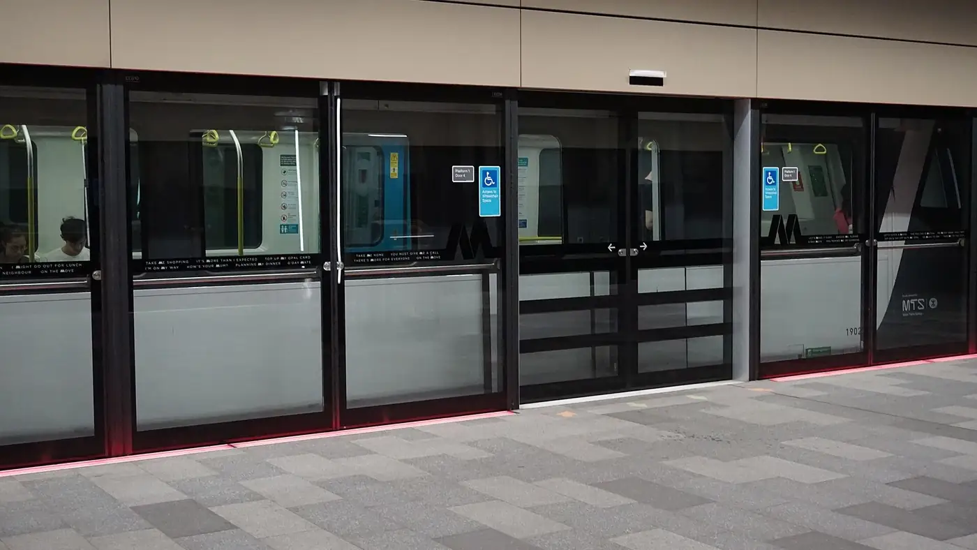 A Sydney Metro train at platform screen doors in the ticketing system Opal 2.0 will replace